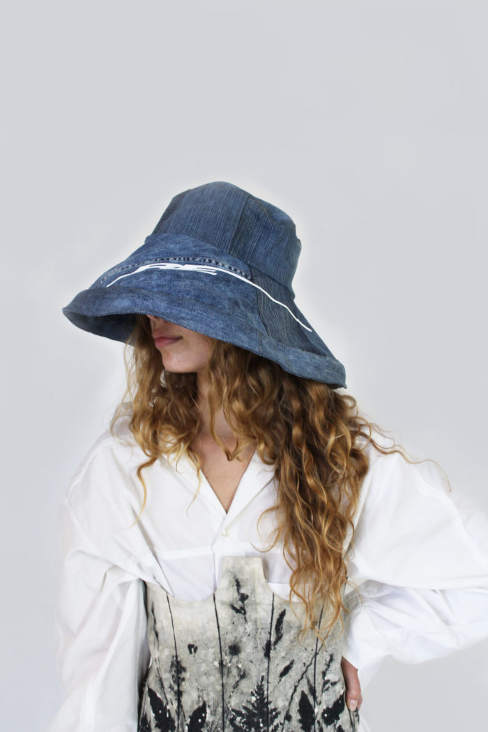 Oversized denim bucket hat, corset with bleeched floral print.