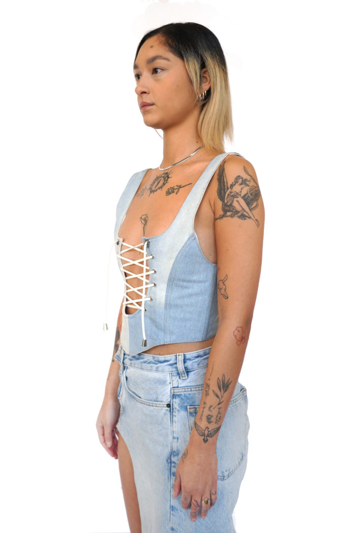 Denim corset made from overstock jeans, with cord details at the front