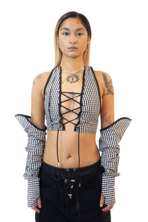 Reconstruct halter top with criss cross front, cleavage revealing top, adjustable. Upcycled top with loose sleeves. sleeves and top can be worn seperately. Bare back. Corset fit. One of One reconstructed top, with black and white checkers.