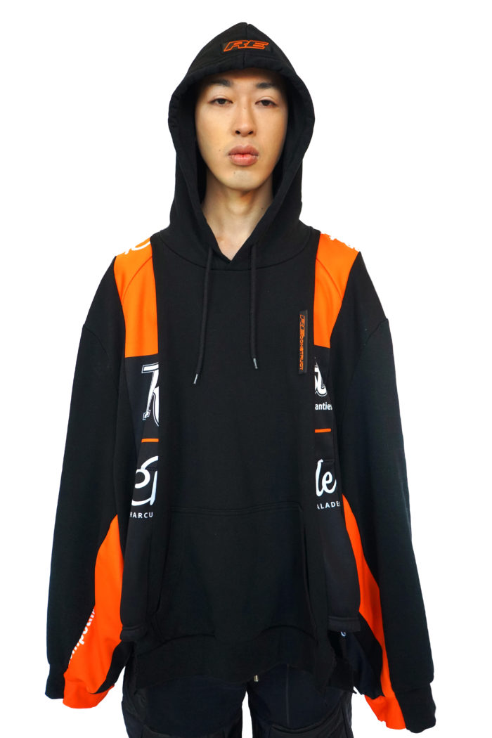 Reconstruct Oversized Patchwork Hoodie, Racer vibe, upcycled, reconstructed hoodie from bio cotton. Paneled hoodie with racer details. Black and orange. Rubber RE detail on hood